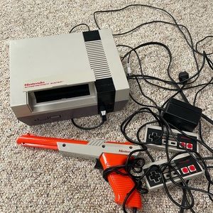 Nintendo console with remotes and games
